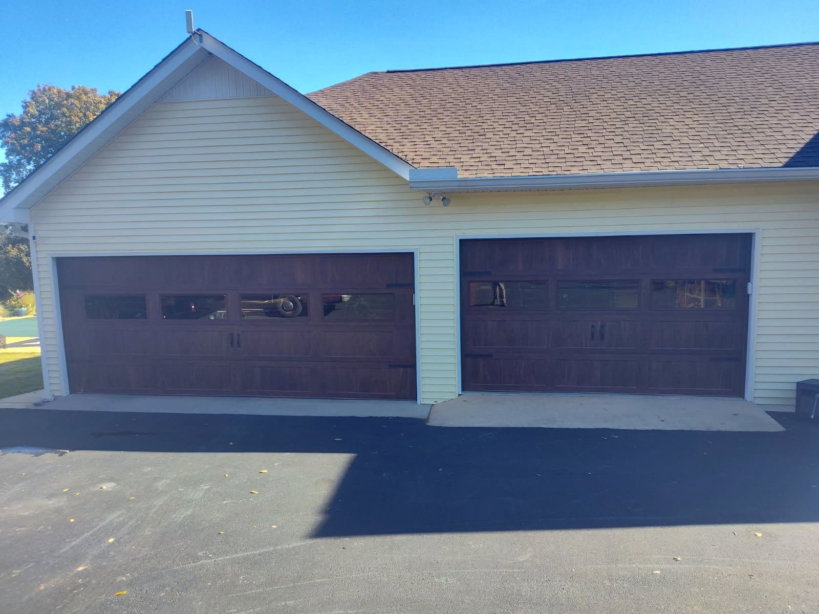 Walnut Garage Door Upgrade with Glass for a Fresh New Look image
